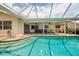 Inviting pool area with covered patio and seating at 1985 Michigan Ne Ave, St Petersburg, FL 33703
