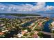 Aerial view of a canal-front house with a large backyard and dock at 1985 Michigan Ne Ave, St Petersburg, FL 33703