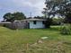 Side view of a single story home with a wooden fence at 1244 Byron Ave, Clearwater, FL 33756