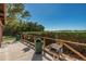 Park grilling area with multiple grills and green trash cans overlooking the water at 6944 S Shore S Dr, South Pasadena, FL 33707