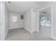 Clean hallway with light gray walls and wood-look floors at 10517 Greenway Ave, Englewood, FL 34224