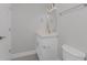 Clean bathroom with white vanity and quartz countertop at 10517 Greenway Ave, Englewood, FL 34224