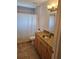 Bathroom featuring vanity with granite countertop, wood cabinets, and shower with curtain at 1740 51St N St, St Petersburg, FL 33710