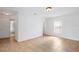 Bright, minimalist bedroom features ceramic tile floors and a window with privacy blinds at 1740 51St N St, St Petersburg, FL 33710
