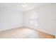 Bright bedroom featuring a window with blinds, tile flooring, and ample natural light, creating a welcoming space at 1740 51St N St, St Petersburg, FL 33710