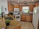 Well-equipped kitchen with granite countertops, stainless steel appliances, and ample cabinet space at 1740 51St N St, St Petersburg, FL 33710
