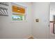 Laundry room featuring a window with views, light colored walls, and tile flooring for a clean and functional space at 1740 51St N St, St Petersburg, FL 33710