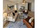 Inviting living room featuring stylish decor, plush seating, and a contemporary rug at 1740 51St N St, St Petersburg, FL 33710