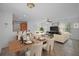 The open-concept living space features ceramic tile floors and is adjacent to the kitchen and dining areas at 1740 51St N St, St Petersburg, FL 33710