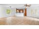 Living room boasts natural light, ceramic tile flooring, and seamless flow to the kitchen at 1740 51St N St, St Petersburg, FL 33710