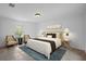 Nicely staged main bedroom with stylish decor, cool colors, and ceramic tile flooring at 1740 51St N St, St Petersburg, FL 33710