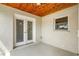 Outdoor patio featuring a wooden ceiling, double doors, and a window, creating an inviting and functional living space at 1740 51St N St, St Petersburg, FL 33710