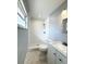 Bathroom featuring tiled shower, modern fixtures, and vanity with basin sink at 4751 Baywood Point S Dr, Gulfport, FL 33711