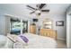 Bedroom with sliding glass doors to the outdoors and pool views at 4751 Baywood Point S Dr, Gulfport, FL 33711