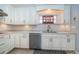 Bright kitchen featuring custom cabinets, modern stainless-steel appliances, and eye-catching backsplash at 4751 Baywood Point S Dr, Gulfport, FL 33711