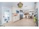 The kitchen features stainless appliances, white cabinets, and an open layout to the living and dining areas at 4751 Baywood Point S Dr, Gulfport, FL 33711