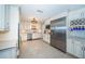 Modern kitchen boasts stainless appliances, custom cabinetry, and an open design for seamless entertaining at 4751 Baywood Point S Dr, Gulfport, FL 33711