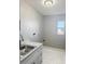 Clean laundry room with a single sink vanity and room to add a washer and dryer at 4751 Baywood Point S Dr, Gulfport, FL 33711