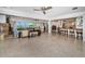 Large living room with views of the waterfront, an open layout to the kitchen and dining area at 4751 Baywood Point S Dr, Gulfport, FL 33711