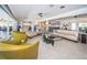 Spacious living room with stylish seating arrangements, fireplace, and an open layout to other rooms in the home at 4751 Baywood Point S Dr, Gulfport, FL 33711