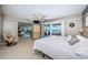 Spacious main bedroom with view and ensuite bathroom. Large sliding glass doors to backyard at 4751 Baywood Point S Dr, Gulfport, FL 33711