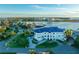 Waterfront property with lush tropical landscaping and serene ocean views of the coast in this aerial photograph at 774 Nina Dr, Tierra Verde, FL 33715