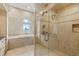Relaxing bathroom boasts a separate glass shower and jetted tub at 774 Nina Dr, Tierra Verde, FL 33715