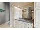 Chic bathroom with granite countertop, recessed lighting and custom white cabinets at 774 Nina Dr, Tierra Verde, FL 33715