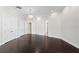 Large bedroom with dark wood floors, neutral walls, and white trim at 774 Nina Dr, Tierra Verde, FL 33715
