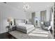 Serene bedroom featuring plush carpeting, soft colors, and a seating area with an abundance of natural light at 774 Nina Dr, Tierra Verde, FL 33715