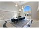 Formal dining area with chandelier and arch window offering ample seating for large parties at 774 Nina Dr, Tierra Verde, FL 33715