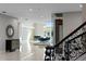 Elegant dining room features a piano, high ceilings, and marble floors at 774 Nina Dr, Tierra Verde, FL 33715