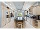 Luxury kitchen with custom white cabinetry, marble countertops and high-end appliances at 774 Nina Dr, Tierra Verde, FL 33715