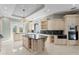 Luxury kitchen with custom white cabinetry, marble countertops and high-end appliances at 774 Nina Dr, Tierra Verde, FL 33715