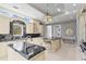 Luxury kitchen with custom white cabinetry, marble countertops and high-end appliances at 774 Nina Dr, Tierra Verde, FL 33715