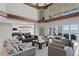 Spacious living room with high ceilings, wood beam accents, and beautiful water views at 774 Nina Dr, Tierra Verde, FL 33715
