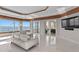 Bright room with water view and a sleek modern sofa for watching TV or relaxing at 774 Nina Dr, Tierra Verde, FL 33715