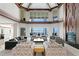 Comfortable seating arrangements with view of the water and fireplace at 774 Nina Dr, Tierra Verde, FL 33715