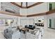 Open living space with modern decor, leading to bar and staircase, perfect for gatherings at 774 Nina Dr, Tierra Verde, FL 33715
