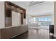 Stunning main bedroom featuring hardwood floors, a wet bar, and access to balcony with ocean views at 774 Nina Dr, Tierra Verde, FL 33715