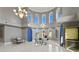 Bright office space with many windows and a chandelier, perfect for productivity and inspiration at 774 Nina Dr, Tierra Verde, FL 33715