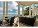 Large covered patio with wicker furniture offering water views at 774 Nina Dr, Tierra Verde, FL 33715