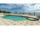 Inviting pool area with waterfront views, a sun deck, and a surrounding white picket fence for added privacy at 774 Nina Dr, Tierra Verde, FL 33715