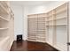 Spacious walk-in closet with custom built-in shelving and drawers for optimal storage and organization at 774 Nina Dr, Tierra Verde, FL 33715