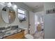 Bathroom featuring modern sink, vanity with storage, and glimpse to a bedroom at 7809 Alafia Dr, Riverview, FL 33578