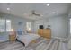 Spacious bedroom with hardwood floors, recessed lighting, ceiling fan, and plantation shutters at 7809 Alafia Dr, Riverview, FL 33578