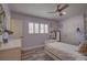 Inviting bedroom with soft purple walls, white furniture, and bright, natural light at 7809 Alafia Dr, Riverview, FL 33578