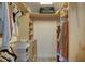 Well-organized walk-in closet with built-in shelves and ample storage for clothes and accessories at 7809 Alafia Dr, Riverview, FL 33578