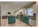 Modern kitchen with stainless appliances, an island, and an open view to living room at 7809 Alafia Dr, Riverview, FL 33578