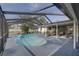 Inviting screened-in pool area with stylish patio furniture perfect for outdoor entertaining at 7809 Alafia Dr, Riverview, FL 33578